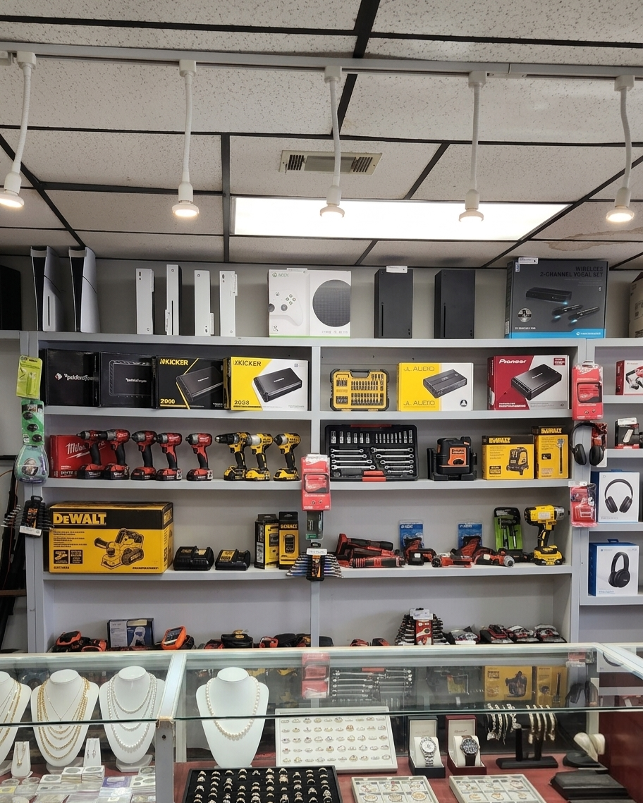Gaming consoles, jewelry, and tools on display